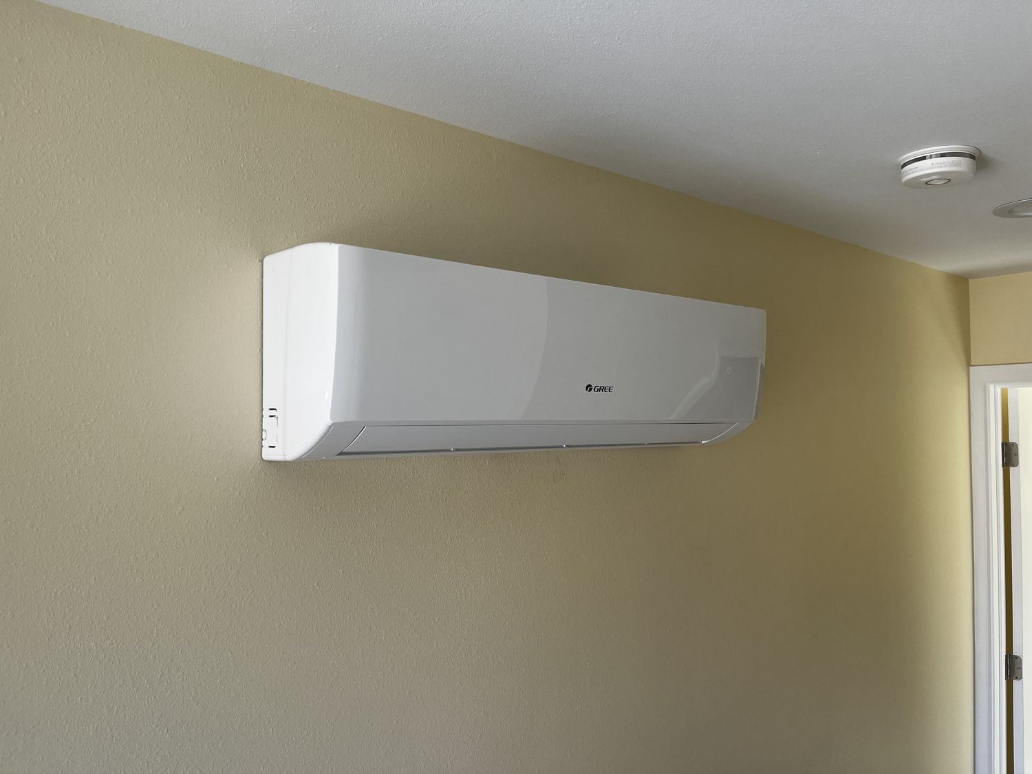 Clean wall-mounted ductless mini-split AC installed in a Pomona home