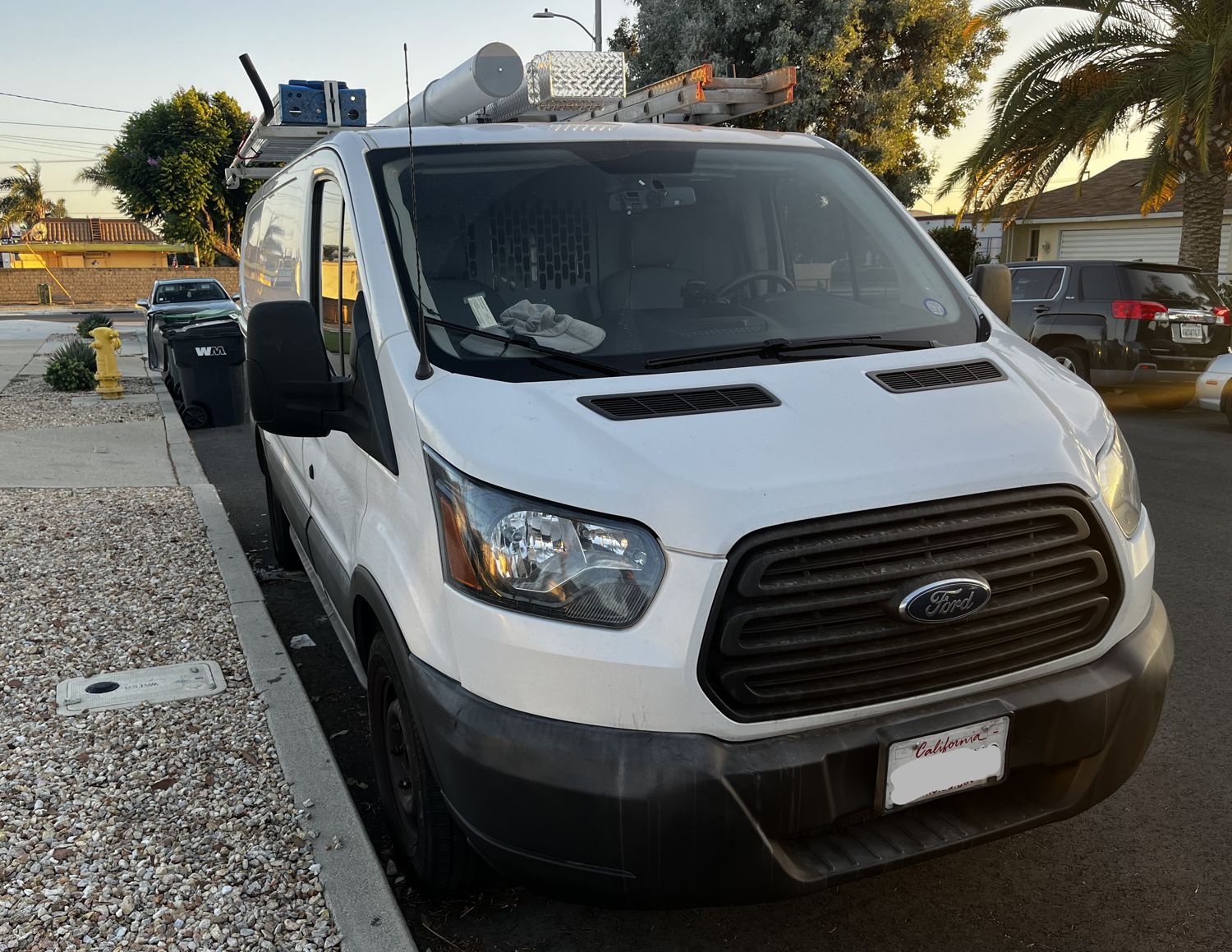 Comfy Climate AC Ford Transit service van parked at a Southern California job