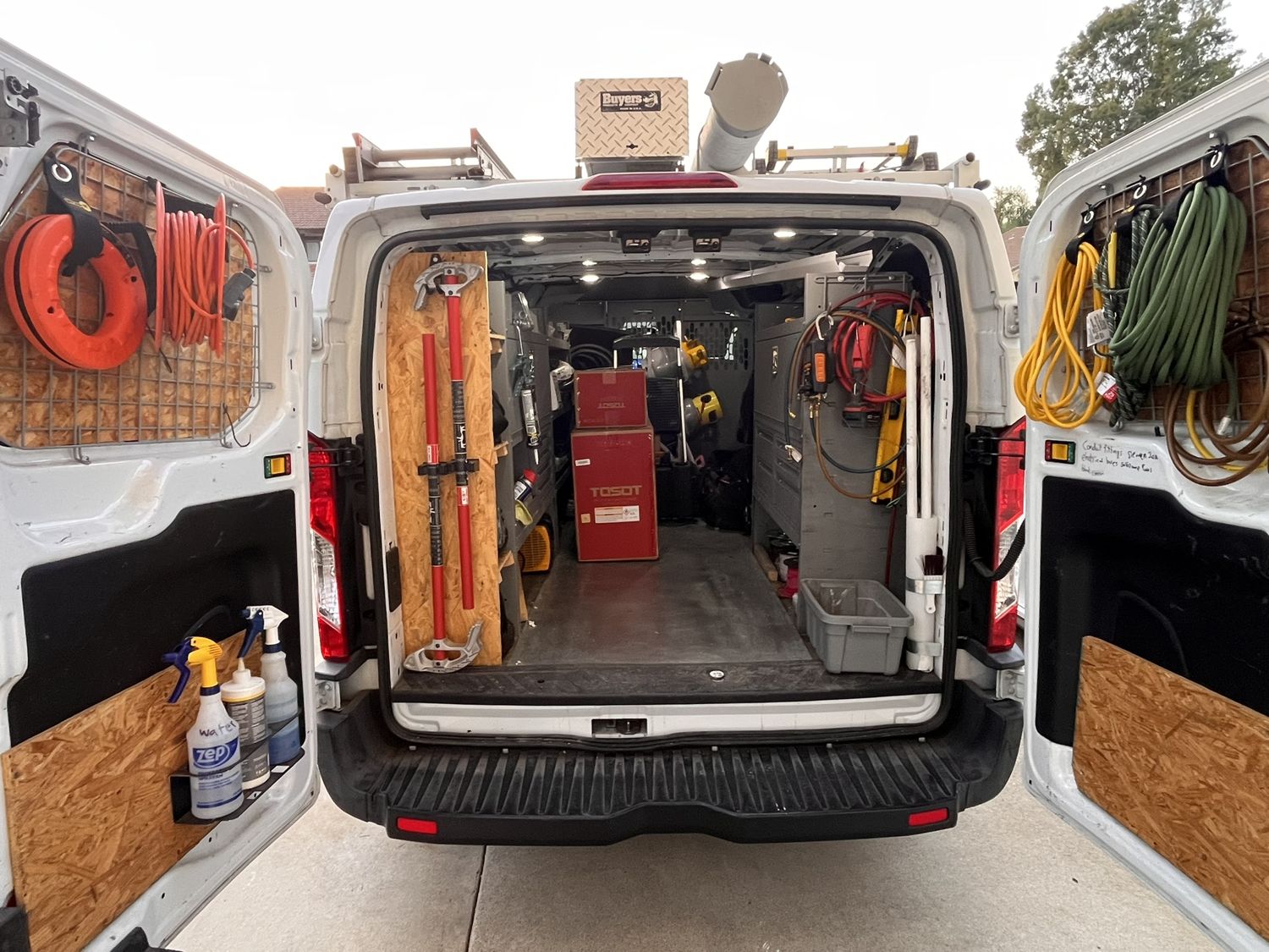Organized HVAC service van interior stocked with tools and equipment